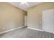 The bedroom features a ceiling fan, neutral wall color, and carpet, creating a cozy atmosphere at 2743 Verandah Vue Way, Lakeland, FL 33812