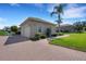Paver driveway leads to a pristine three-car garage, complementing the home's charming exterior at 2743 Verandah Vue Way, Lakeland, FL 33812