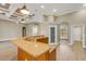 Open-concept kitchen featuring granite countertops, a pantry, and modern recessed lighting at 2743 Verandah Vue Way, Lakeland, FL 33812