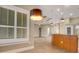 Bright kitchen with wood-look tile floors, granite countertops, wood cabinets, and an island sink at 2743 Verandah Vue Way, Lakeland, FL 33812