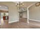 Spacious living room with wood tile flooring, columns, and decorative lighting at 2743 Verandah Vue Way, Lakeland, FL 33812