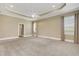 Large main bedroom featuring a tray ceiling, soft carpet, and ample natural light from multiple windows at 2743 Verandah Vue Way, Lakeland, FL 33812