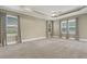 Spacious main bedroom with neutral carpet, a ceiling fan, and double windows for natural light at 2743 Verandah Vue Way, Lakeland, FL 33812