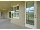 Covered patio with door and window offers a glimpse into the outdoor living space at 2743 Verandah Vue Way, Lakeland, FL 33812