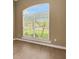 Bedroom with a large window, allowing natural light to come through the window's horizontal blinds at 2743 Verandah Vue Way, Lakeland, FL 33812