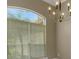 Bright room featuring a large window and stylish chandelier at 2743 Verandah Vue Way, Lakeland, FL 33812