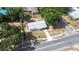Aerial shot of the house displaying the roof, yard, and driveway, plus surrounding homes at 280 W Pierce St, Lake Alfred, FL 33850
