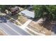 Aerial shot of the house displaying the roof, yard, and driveway, plus surrounding homes at 280 W Pierce St, Lake Alfred, FL 33850