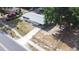 Aerial shot of the house displaying the roof, yard, and driveway, plus surrounding homes at 280 W Pierce St, Lake Alfred, FL 33850