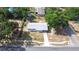 Aerial shot of the house displaying the roof, yard, and driveway, plus surrounding homes at 280 W Pierce St, Lake Alfred, FL 33850