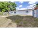 Backyard features mature trees, providing ample shade on a sunny day at 280 W Pierce St, Lake Alfred, FL 33850