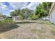 View of the spacious backyard and fence, ideal for outdoor activities and privacy at 280 W Pierce St, Lake Alfred, FL 33850