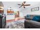 Open-concept living room with hardwood floors seamlessly connects to the kitchen, creating a welcoming space at 280 W Pierce St, Lake Alfred, FL 33850
