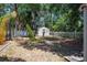 View of the backyard showing shed, screened in pool and mature trees for added privacy at 2933 Blackwater Oaks Dr, Mulberry, FL 33860