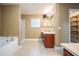 Bathroom featuring a glass-enclosed shower, tub, and closet at 2933 Blackwater Oaks Dr, Mulberry, FL 33860