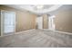 Large bedroom with tray ceilings, plush carpet, and lots of natural light at 2933 Blackwater Oaks Dr, Mulberry, FL 33860