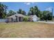 Charming brick home with attached two-car garage and a well-manicured lawn at 2933 Blackwater Oaks Dr, Mulberry, FL 33860