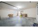 Uncluttered two-car garage featuring a workbench and ample open space at 2933 Blackwater Oaks Dr, Mulberry, FL 33860