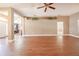Large living area with laminate flooring, neutral color palette, and views of the front yard at 2933 Blackwater Oaks Dr, Mulberry, FL 33860