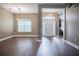 Open concept living room with wood floors and natural light at 2933 Blackwater Oaks Dr, Mulberry, FL 33860