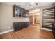 Bright living space featuring laminate floors, built in cabinetry, and neutral color palette at 2933 Blackwater Oaks Dr, Mulberry, FL 33860