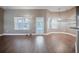 Open living room with laminate floors, neutral color palette, and views of the screened pool area at 2933 Blackwater Oaks Dr, Mulberry, FL 33860