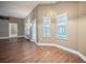 Bright living space featuring laminate floors and views of the backyard swimming pool at 2933 Blackwater Oaks Dr, Mulberry, FL 33860