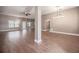 Spacious living room featuring wood floors, a ceiling fan, and an open layout at 2933 Blackwater Oaks Dr, Mulberry, FL 33860