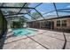 This pool is fully enclosed with a brick paver deck and has plenty of room for activities at 2933 Blackwater Oaks Dr, Mulberry, FL 33860