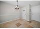 Charming dining area featuring tiled floors and an elegant chandelier at 3002 Helms Dr, Auburndale, FL 33823
