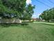 Spacious front yard with a charming ranch style home at 3002 Helms Dr, Auburndale, FL 33823