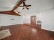 Bright living room with vaulted ceilings, ceiling fans, hardwood floors, and a unique entrance at 3002 Helms Dr, Auburndale, FL 33823