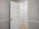 Walk-in pantry boasts ample storage with wire shelving units at 3002 Helms Dr, Auburndale, FL 33823