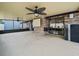 Spacious, enclosed patio featuring concrete flooring and ceiling fans at 3002 Helms Dr, Auburndale, FL 33823