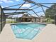 This is an enclosed pool with seating around it at 3002 Helms Dr, Auburndale, FL 33823