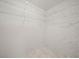 Walk-in closet with white wire shelving for optimal storage and organization at 3002 Helms Dr, Auburndale, FL 33823