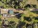 Aerial view showcasing property with home, outbuilding, and a long driveway at 3233 Gardner Rd, Lakeland, FL 33810