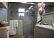 Bathroom featuring a walk-in tiled shower, complemented by modern vanity at 3233 Gardner Rd, Lakeland, FL 33810