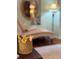 Small crown decoration in front of a blurred living room background with chaise lounge and mirror at 3233 Gardner Rd, Lakeland, FL 33810