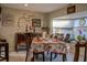 Cozy dining room featuring a floral tablecloth, stylish decor, and plenty of natural light at 3233 Gardner Rd, Lakeland, FL 33810