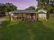 Well-kept single-story home with front porch, landscaping, and a charming covered entryway at 3233 Gardner Rd, Lakeland, FL 33810