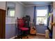 Stylish spare room with wainscotting, guitar, desk, mirror, and window for natural light at 3233 Gardner Rd, Lakeland, FL 33810