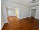 Spacious living room featuring hardwood floors and a classic chandelier for an inviting atmosphere at 375 Westover Pkwy, Bartow, FL 33830