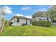 Backyard featuring privacy landscaping, home's exterior, and pool enclosure at 3822 Marquise Ln, Mulberry, FL 33860