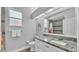 Clean bathroom with granite countertops, white cabinetry, toilet, and shower/tub combination at 3822 Marquise Ln, Mulberry, FL 33860