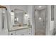 Stylish bathroom with granite countertop, gold fixtures, and glass-enclosed shower at 3822 Marquise Ln, Mulberry, FL 33860