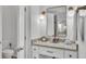 Neat bathroom with granite countertops, vanity, mirror, and toilet at 3822 Marquise Ln, Mulberry, FL 33860