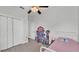 Bright bedroom features a large closet and whimsical decor, creating a playful atmosphere at 3822 Marquise Ln, Mulberry, FL 33860