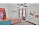 Pretty bedroom with pink curtains and a white dresser at 3822 Marquise Ln, Mulberry, FL 33860