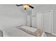 A cozy bedroom with a ceiling fan and double door closet at 3822 Marquise Ln, Mulberry, FL 33860